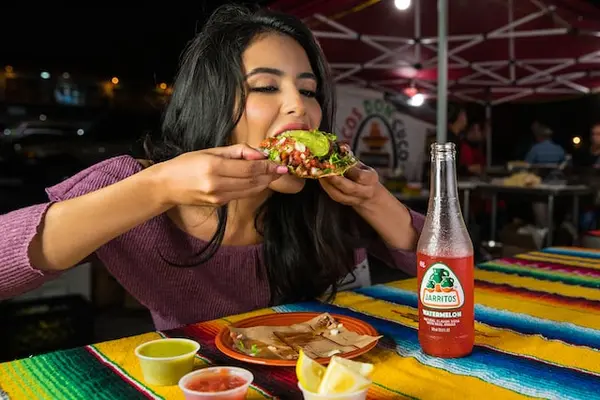 Young woman eating mexican food